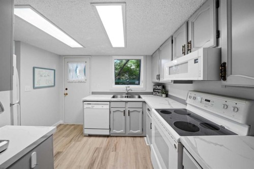 13 Spruce Drive, Lacombe, AB - Indoor Photo Showing Kitchen With Double Sink