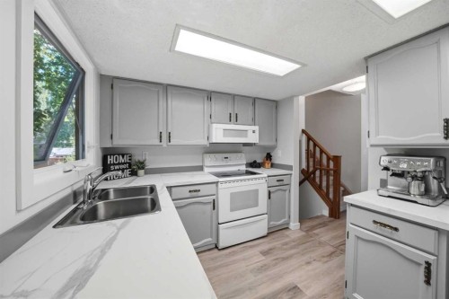 13 Spruce Drive, Lacombe, AB - Indoor Photo Showing Kitchen With Double Sink