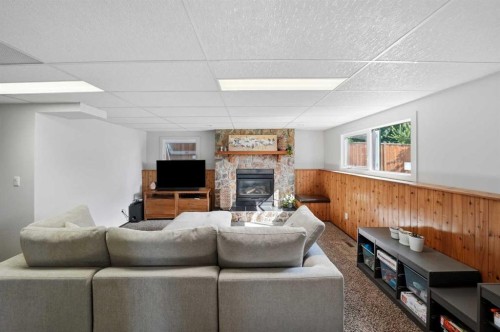 13 Spruce Drive, Lacombe, AB - Indoor Photo Showing Living Room With Fireplace