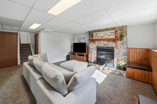 13 Spruce Drive, Lacombe, AB - Indoor Photo Showing Other Room With Fireplace