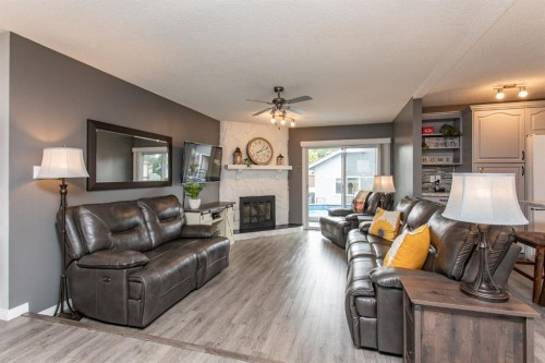 8 Caswell Close, Red Deer, AB - Indoor Photo Showing Living Room With Fireplace