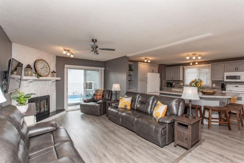 8 Caswell Close, Red Deer, AB - Indoor Photo Showing Living Room With Fireplace