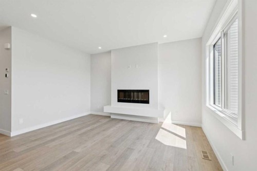 162 Drystone Way Nw, Calgary, AB - Indoor Photo Showing Living Room With Fireplace