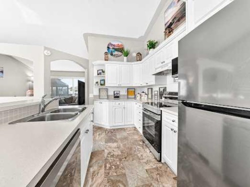 2-6220 Orr Drive, Red Deer, AB - Indoor Photo Showing Kitchen With Double Sink With Upgraded Kitchen