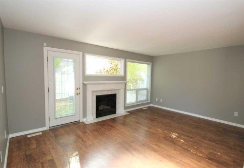 52-73 Addington Drive, Red Deer, AB - Indoor Photo Showing Living Room With Fireplace
