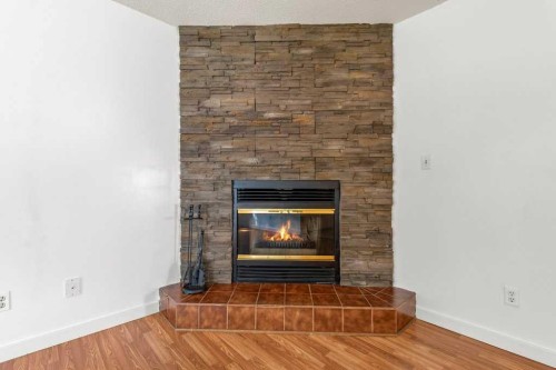 56 Elder Street, Red Deer, AB - Indoor Photo Showing Living Room With Fireplace