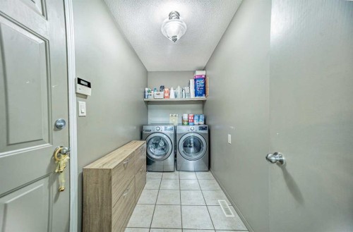 27 Escott Close, Red Deer, AB - Indoor Photo Showing Laundry Room