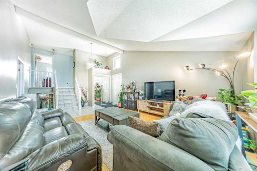 27 Escott Close, Red Deer, AB - Indoor Photo Showing Living Room With Fireplace