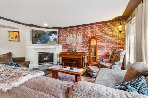 56 Jones Crescent, Red Deer, AB - Indoor Photo Showing Living Room With Fireplace