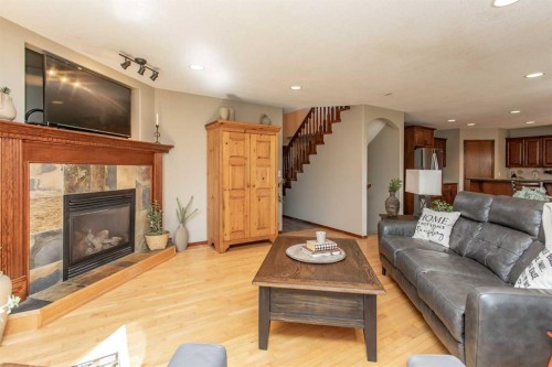 715 700 Ramage Close, Red Deer, AB - Indoor Photo Showing Living Room With Fireplace