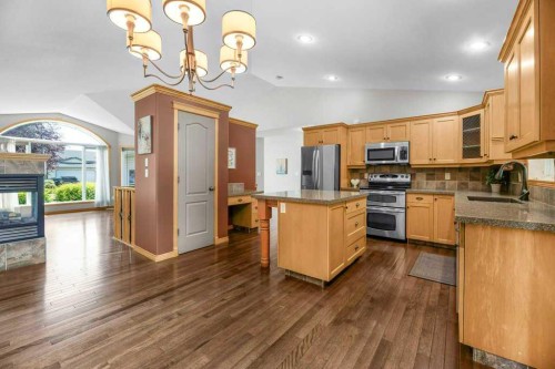 34 Duffield Avenue, Red Deer, AB - Indoor Photo Showing Kitchen With Fireplace