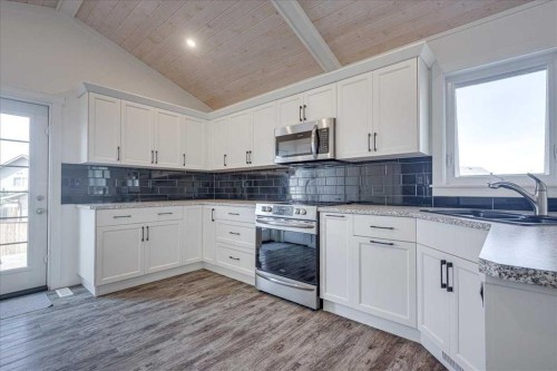 58 Ranchers Close, Lacombe, AB - Indoor Photo Showing Kitchen With Double Sink