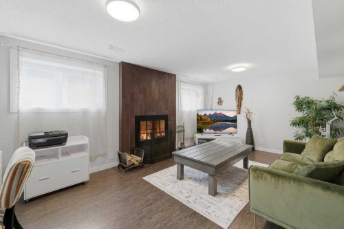 49 Macfarlane Avenue, Red Deer, AB - Indoor Photo Showing Living Room With Fireplace