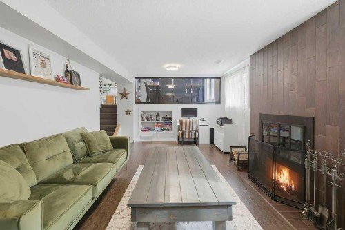 49 Macfarlane Avenue, Red Deer, AB - Indoor Photo Showing Living Room With Fireplace