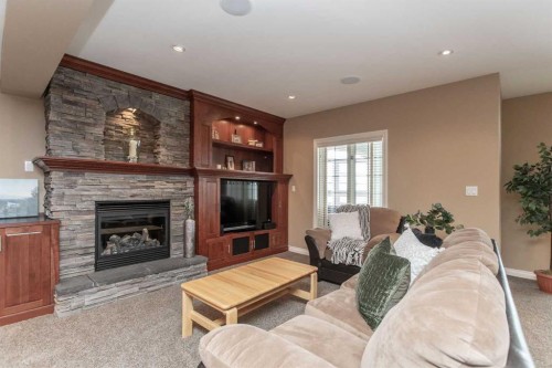 217-27111 Highway 597, Rural Lacombe County, AB - Indoor Photo Showing Living Room With Fireplace