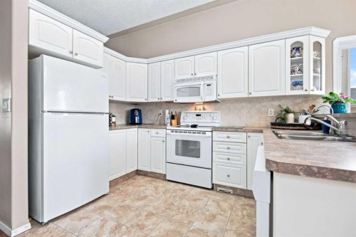 98 Duval Crescent, Red Deer, AB - Indoor Photo Showing Kitchen With Double Sink