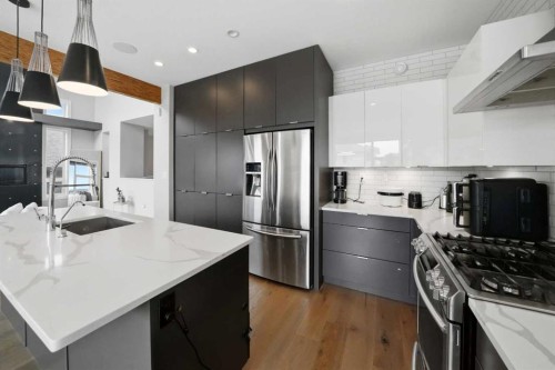 102 Longmire Close, Red Deer, AB - Indoor Photo Showing Kitchen With Stainless Steel Kitchen With Upgraded Kitchen