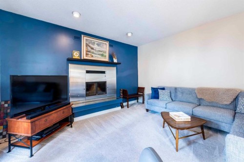 19 Maxwell Avenue, Red Deer, AB - Indoor Photo Showing Living Room With Fireplace