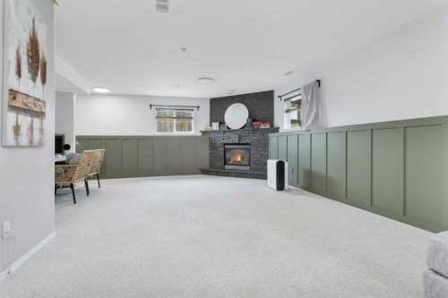 70 Garden Road, Lacombe, AB - Indoor With Fireplace