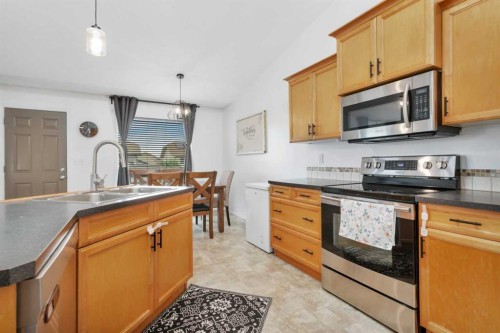 70 Garden Road, Lacombe, AB - Indoor Photo Showing Kitchen With Double Sink