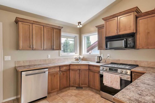 68 Isbister Close, Red Deer, AB - Indoor Photo Showing Kitchen With Double Sink