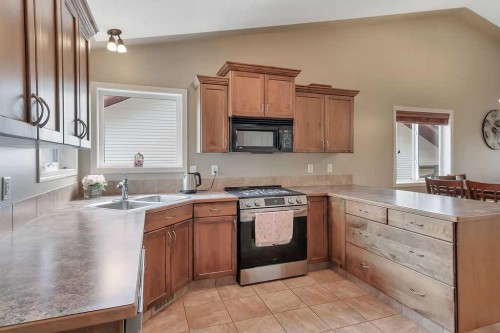 68 Isbister Close, Red Deer, AB - Indoor Photo Showing Kitchen With Double Sink