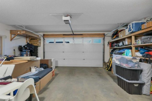203 Cedar Square, Blackfalds, AB - Indoor Photo Showing Garage