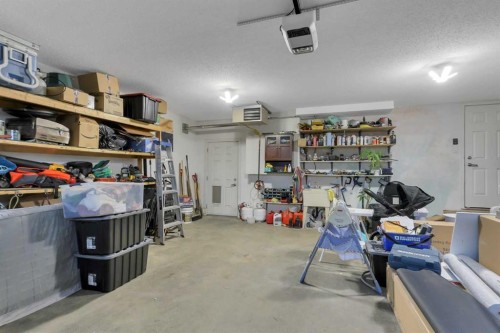 203 Cedar Square, Blackfalds, AB - Indoor Photo Showing Garage