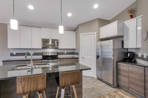 203 Cedar Square, Blackfalds, AB - Indoor Photo Showing Kitchen With Stainless Steel Kitchen With Double Sink With Upgraded Kitchen