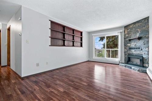 305-71 Cosgrove Crescent, Red Deer, AB - Indoor With Fireplace