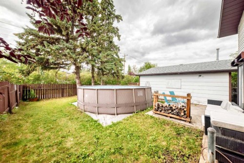 165 Wilson Crescent, Red Deer, AB - Outdoor With Above Ground Pool