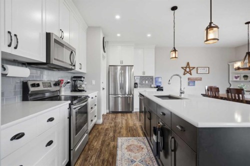 217 Augustus Way, Penhold, AB - Indoor Photo Showing Kitchen With Stainless Steel Kitchen With Upgraded Kitchen