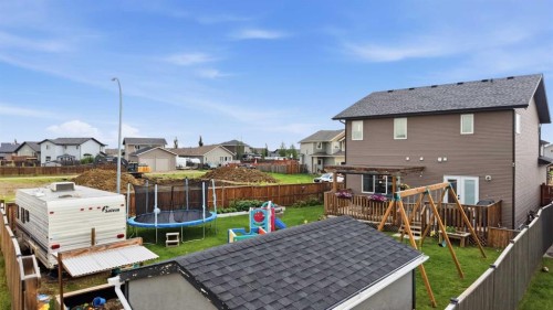 217 Augustus Way, Penhold, AB - Outdoor With Deck Patio Veranda With Exterior