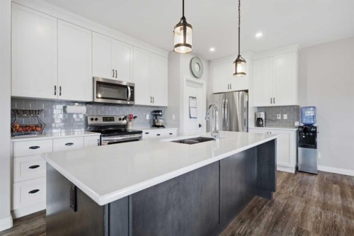 217 Augustus Way, Penhold, AB - Indoor Photo Showing Kitchen With Stainless Steel Kitchen With Upgraded Kitchen