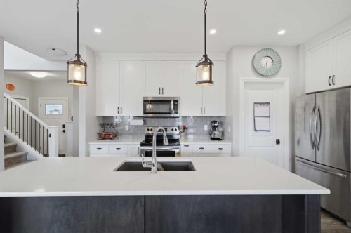 217 Augustus Way, Penhold, AB - Indoor Photo Showing Kitchen With Stainless Steel Kitchen With Upgraded Kitchen