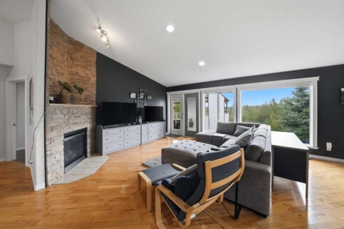 2 Estella Crescent, Lacombe, AB - Indoor Photo Showing Living Room With Fireplace