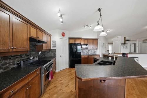 2 Estella Crescent, Lacombe, AB - Indoor Photo Showing Kitchen With Double Sink