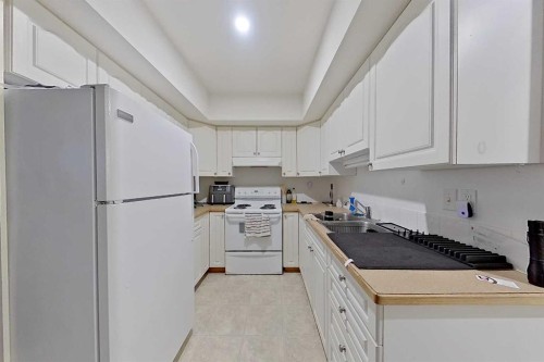 5115 48 Avenue, Sylvan Lake, AB - Indoor Photo Showing Kitchen With Double Sink