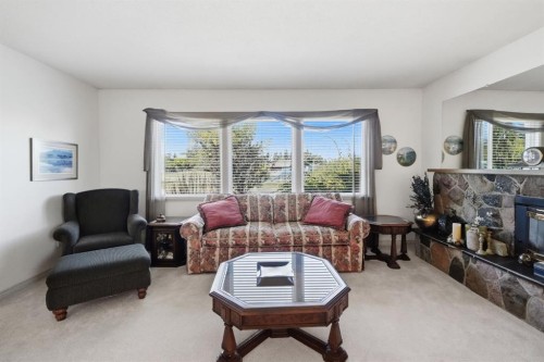 4021 Embury Crescent, Red Deer, AB - Indoor Photo Showing Living Room With Fireplace