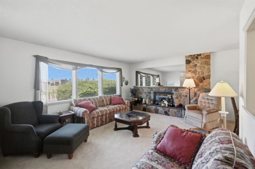 4021 Embury Crescent, Red Deer, AB - Indoor Photo Showing Living Room With Fireplace