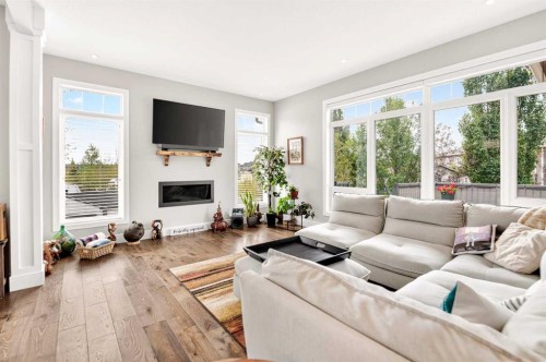 77 Grove Close, Red Deer, AB - Indoor Photo Showing Living Room With Fireplace