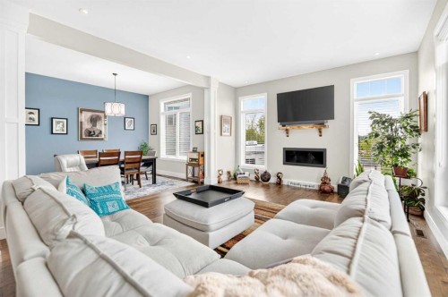 77 Grove Close, Red Deer, AB - Indoor Photo Showing Living Room With Fireplace