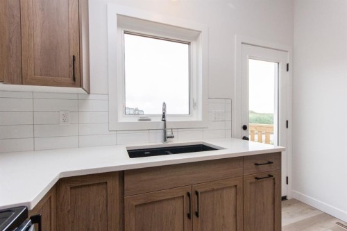 5 Beacon Hill Drive, Sylvan Lake, AB - Indoor Photo Showing Kitchen With Double Sink