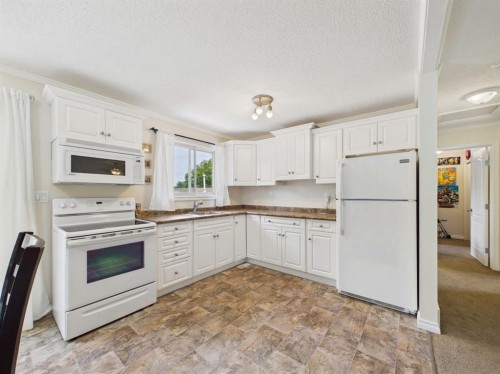42 Greenham Drive, Red Deer, AB - Indoor Photo Showing Kitchen With Double Sink
