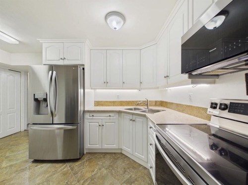 42 Greenham Drive, Red Deer, AB - Indoor Photo Showing Kitchen With Double Sink