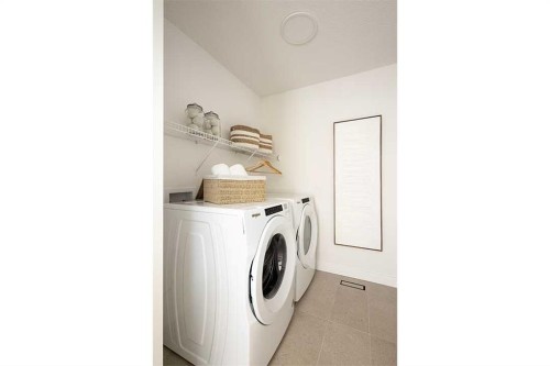 59 Annette Green Nw, Calgary, AB - Indoor Photo Showing Laundry Room