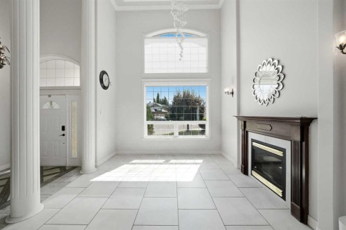25 Ashmore Close, Red Deer, AB - Indoor Photo Showing Other Room With Fireplace