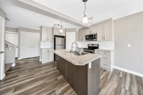 66 Ranchers Close, Lacombe, AB - Indoor Photo Showing Kitchen With Double Sink With Upgraded Kitchen