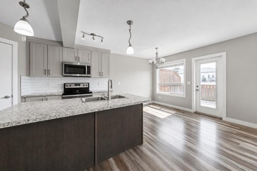 66 Ranchers Close, Lacombe, AB - Indoor Photo Showing Kitchen With Double Sink With Upgraded Kitchen