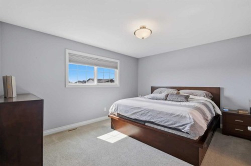64 Henderson Crescent, Penhold, AB - Indoor Photo Showing Bedroom